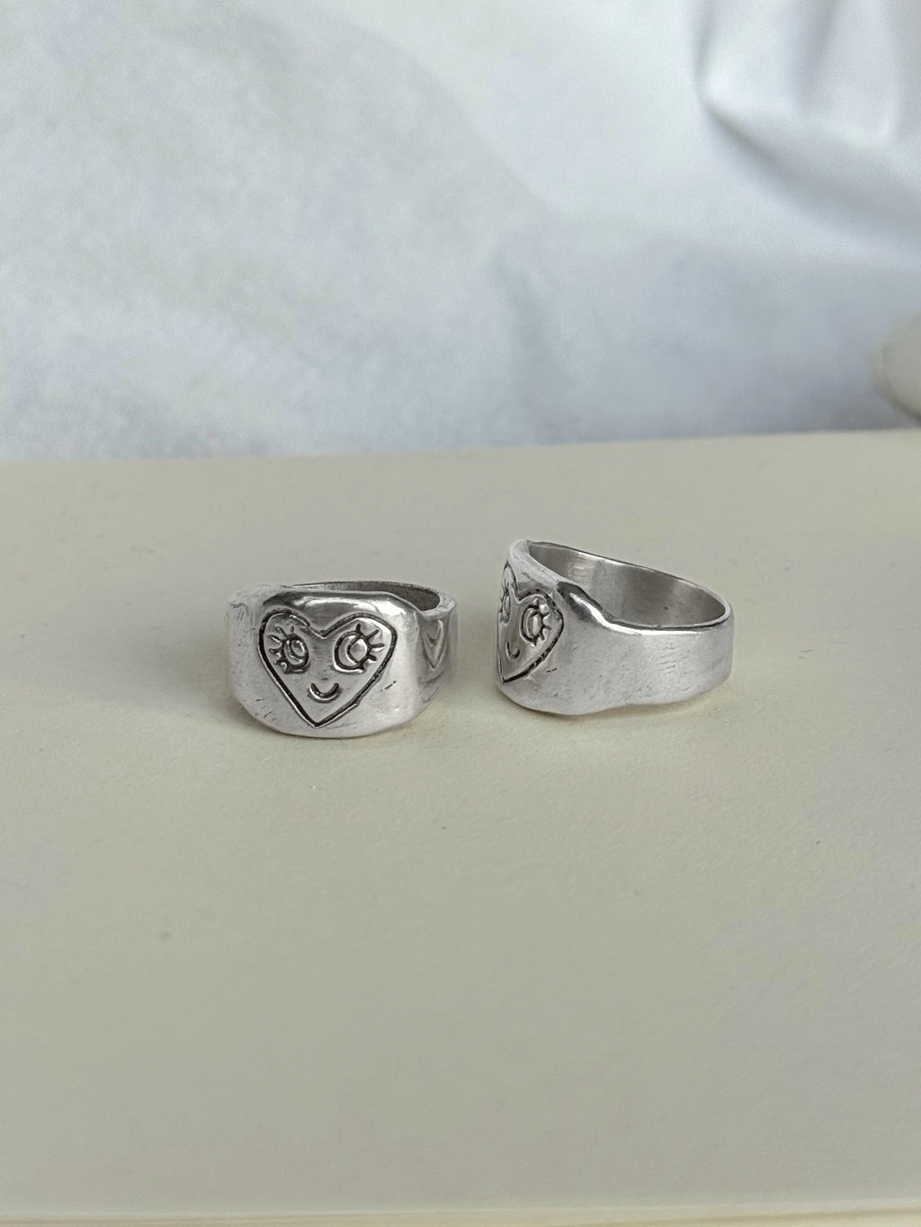 Smiling heart ring